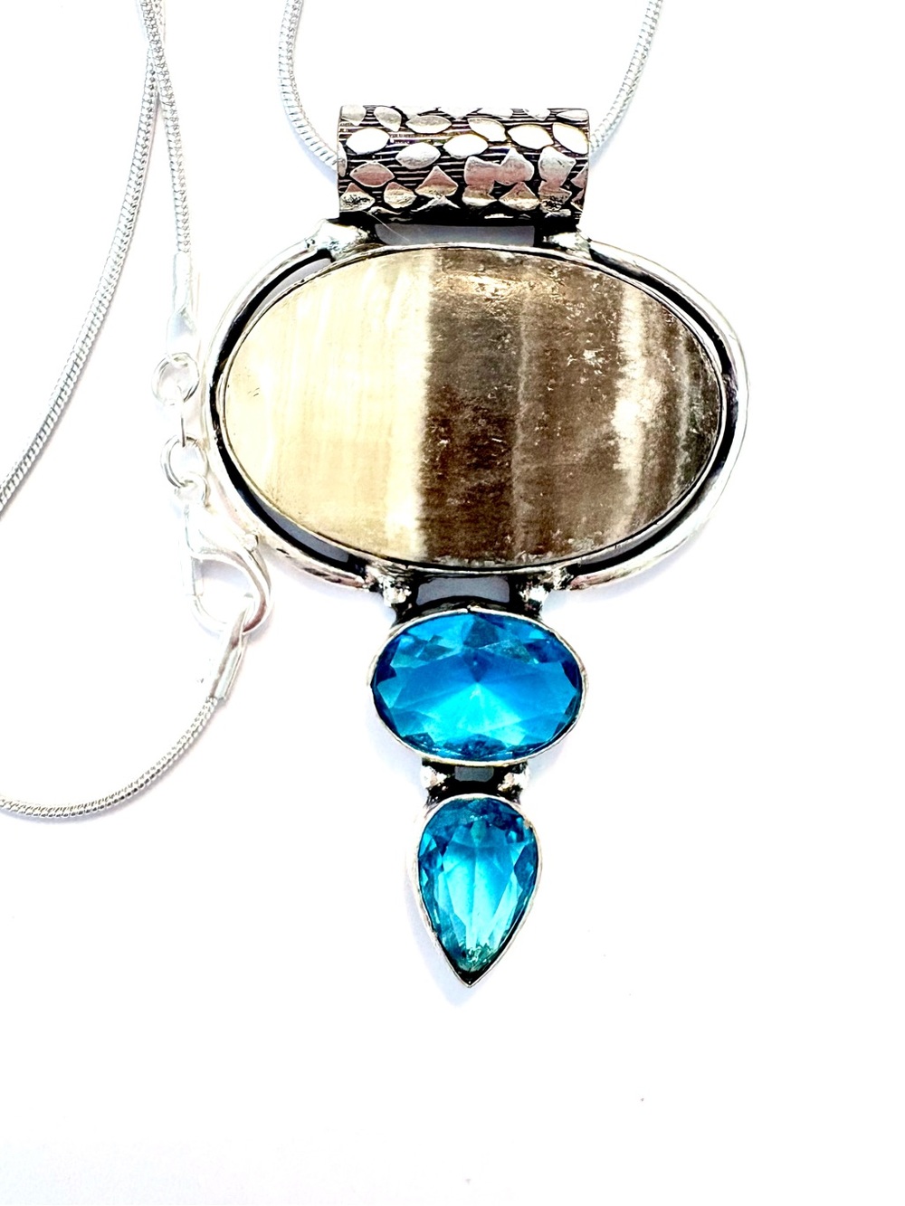 2 inch, 925 makes, Yellow Lace Agate and Blue Topaz pendant on a silver chain.